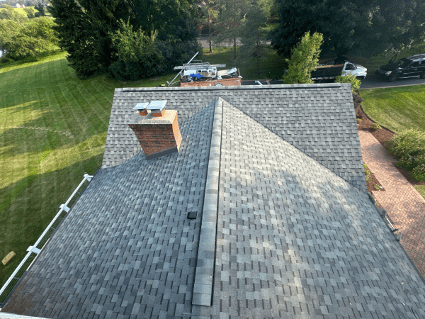 An aerial view of a roof with a chimney on it