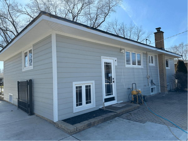 A house with a lot of windows on the side of it.