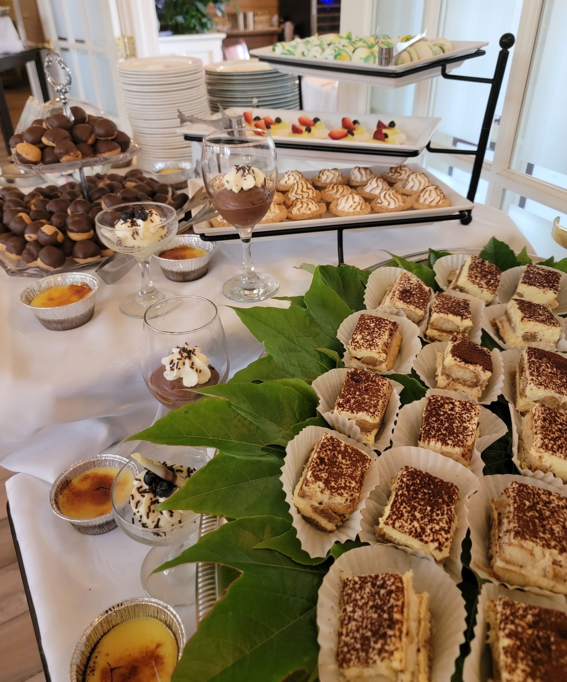 a buffet table with a variety of desserts on it