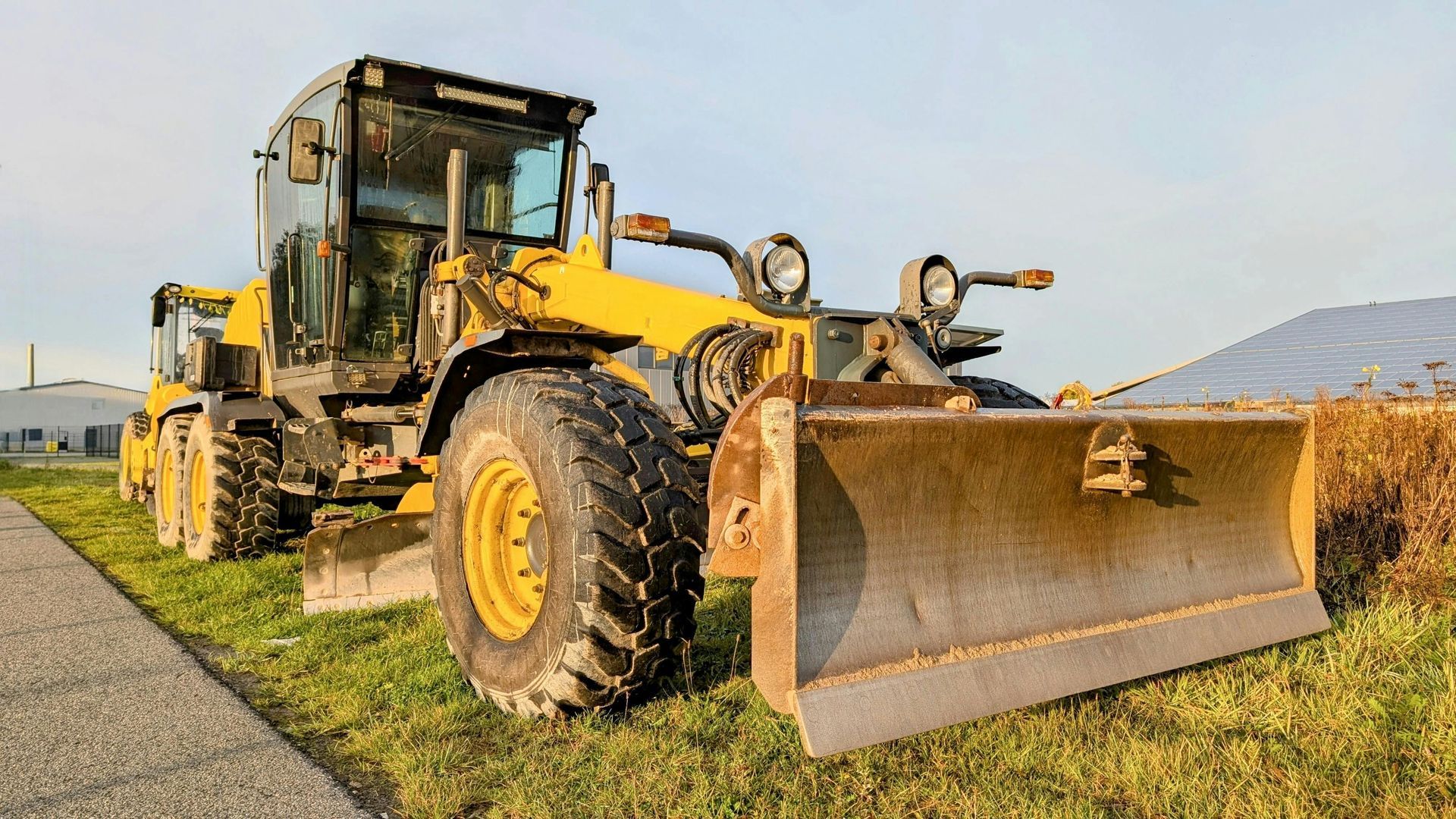 A person wearing gloves is rolling a roll of grass.