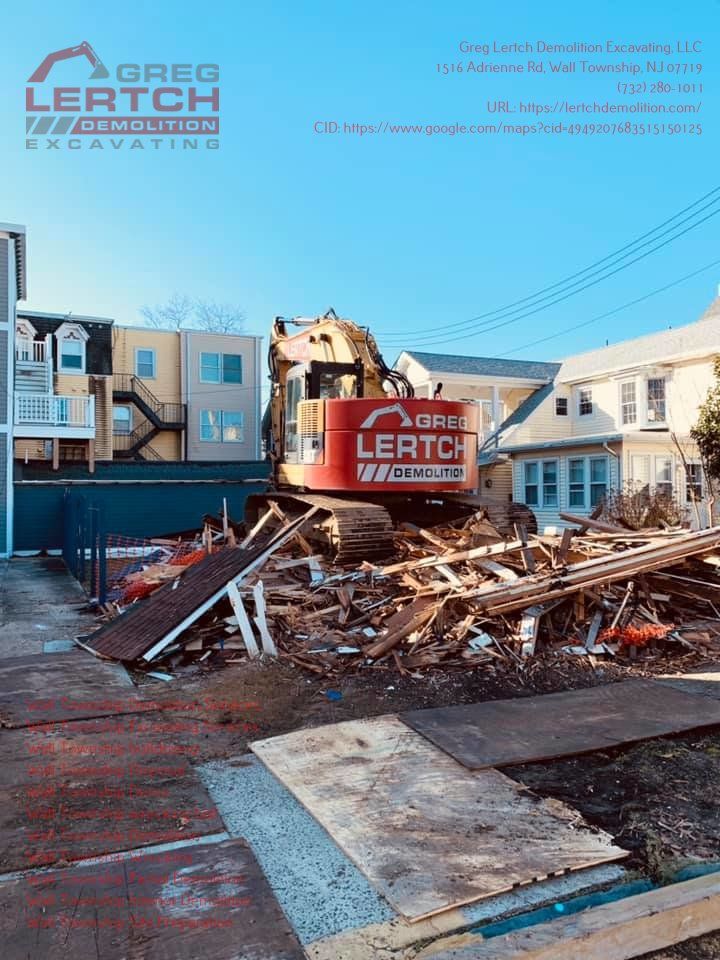 A red and yellow excavator is demolishing a house.
