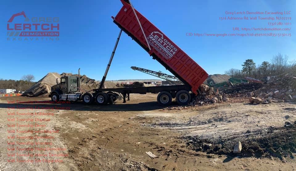 A red dump truck with the word lertch on the side