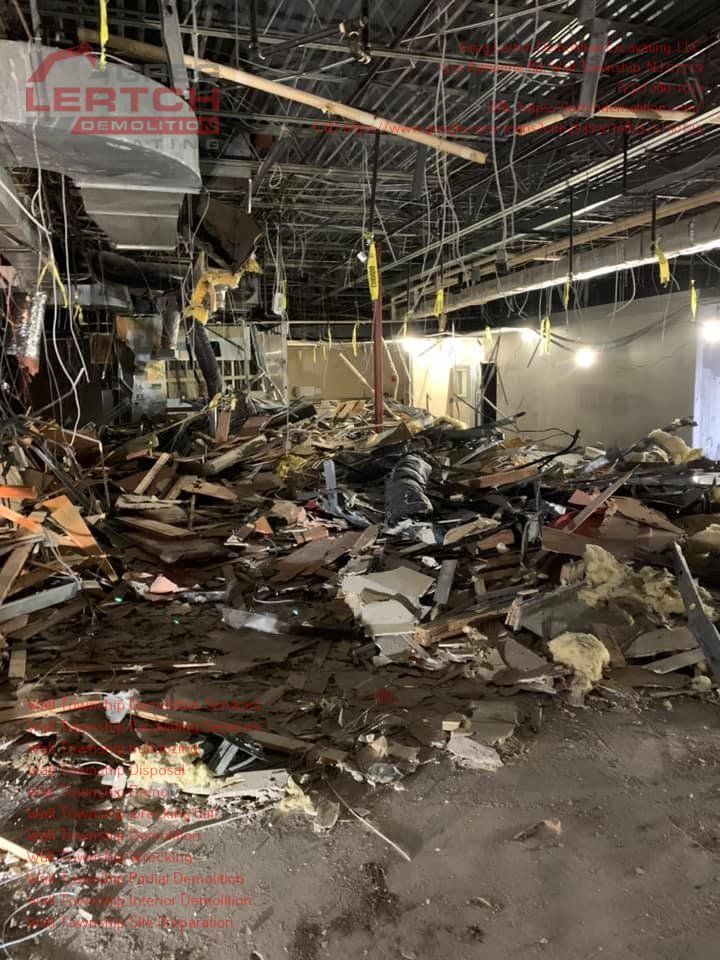 A large pile of rubble is sitting in the middle of a building under construction