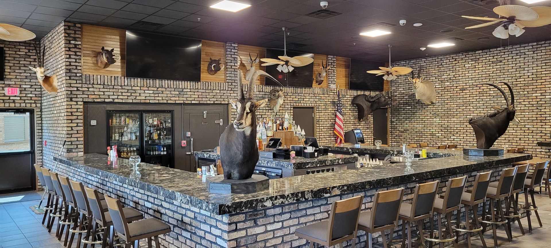 There is a long bar in the middle of the room.