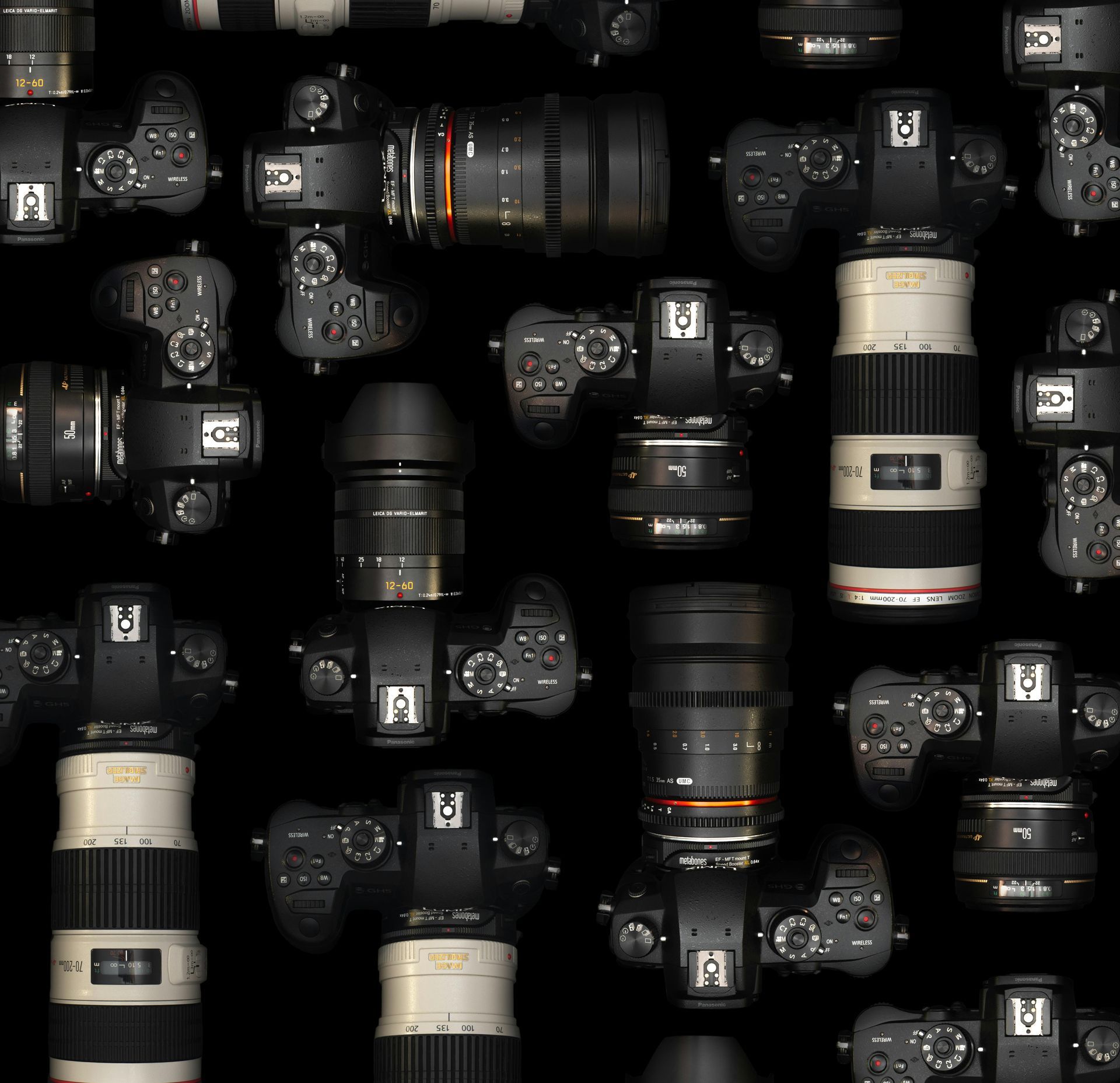 A pattern of various professional digital cameras and lenses arranged against a solid black background.