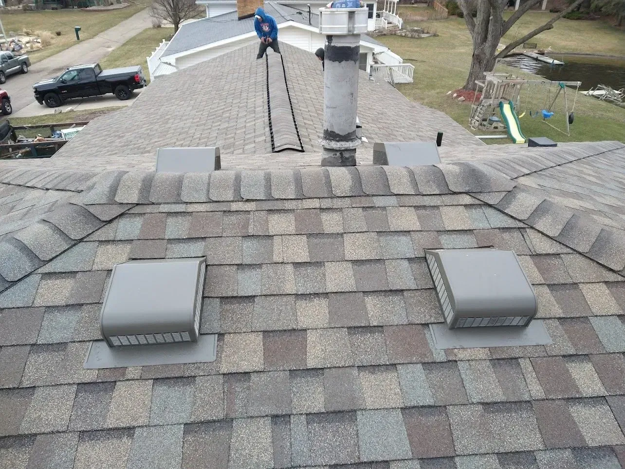 Rooftop with installed vents and a chimney.