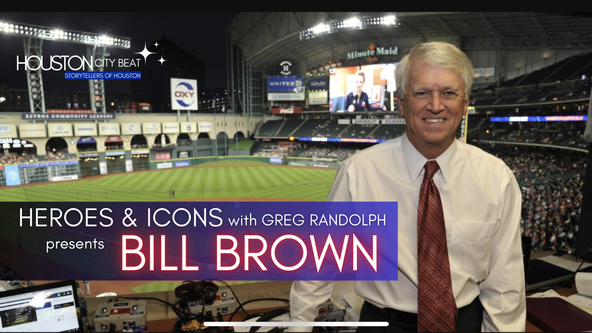 A man is standing in front of a screen that says bill brown