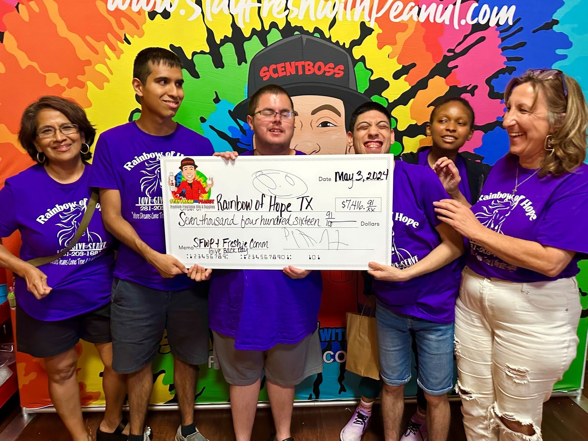 Receiving a monetary donation from Stay Fresh with Peanut
