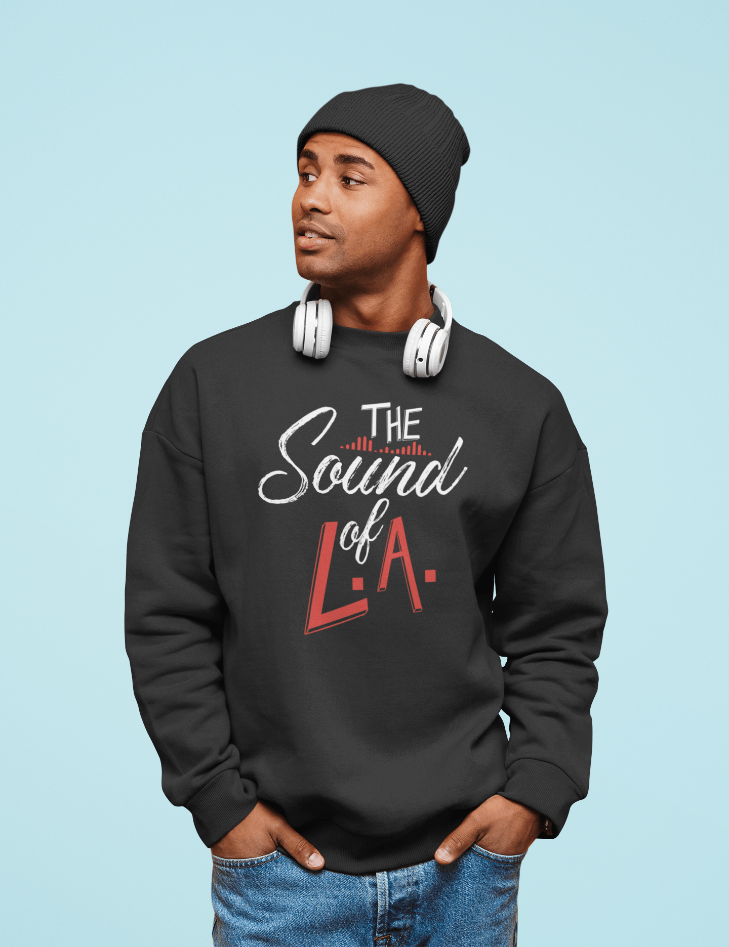 A man wearing a black sweatshirt that says the sound of la