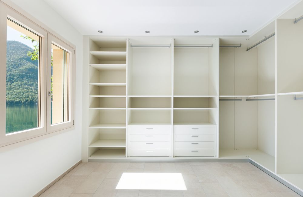 A Empty White Walk-in Closet With Shelves, Drawers — Kitchens Factory Direct in Port Macquarie, NSW