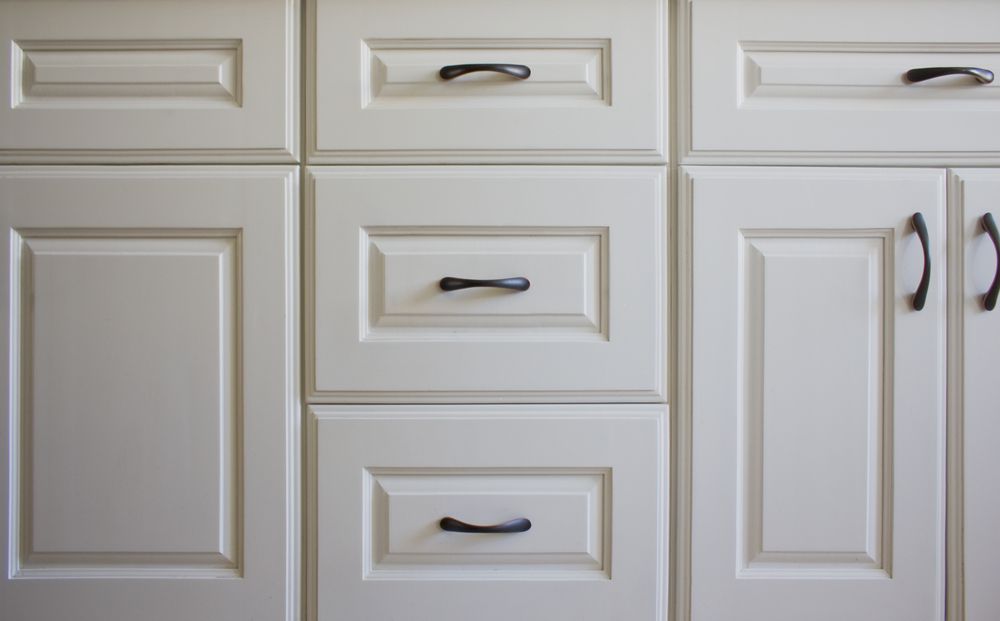 A White Kitchen Cabinets With Black Handle — Kitchens Factory Direct in Port Macquarie, NSW