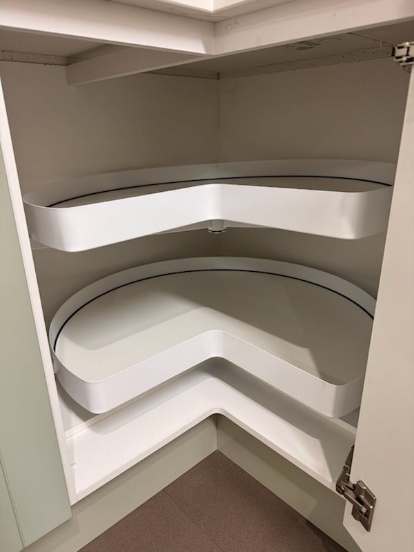 White corner kitchen cabinet with two rotating shelves. — Kitchens Factory Direct in Port Macquarie, NSW