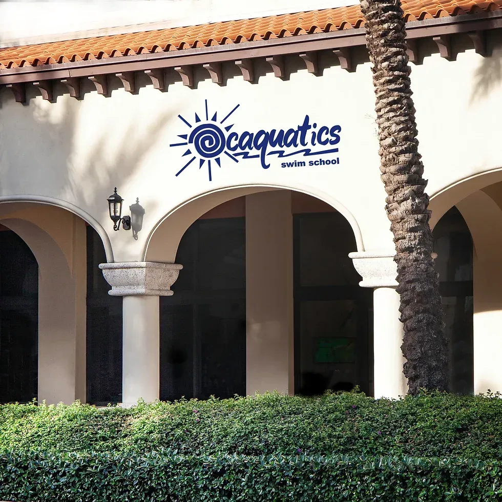 A building with arches and a sign that says Ocaquatics Swim School