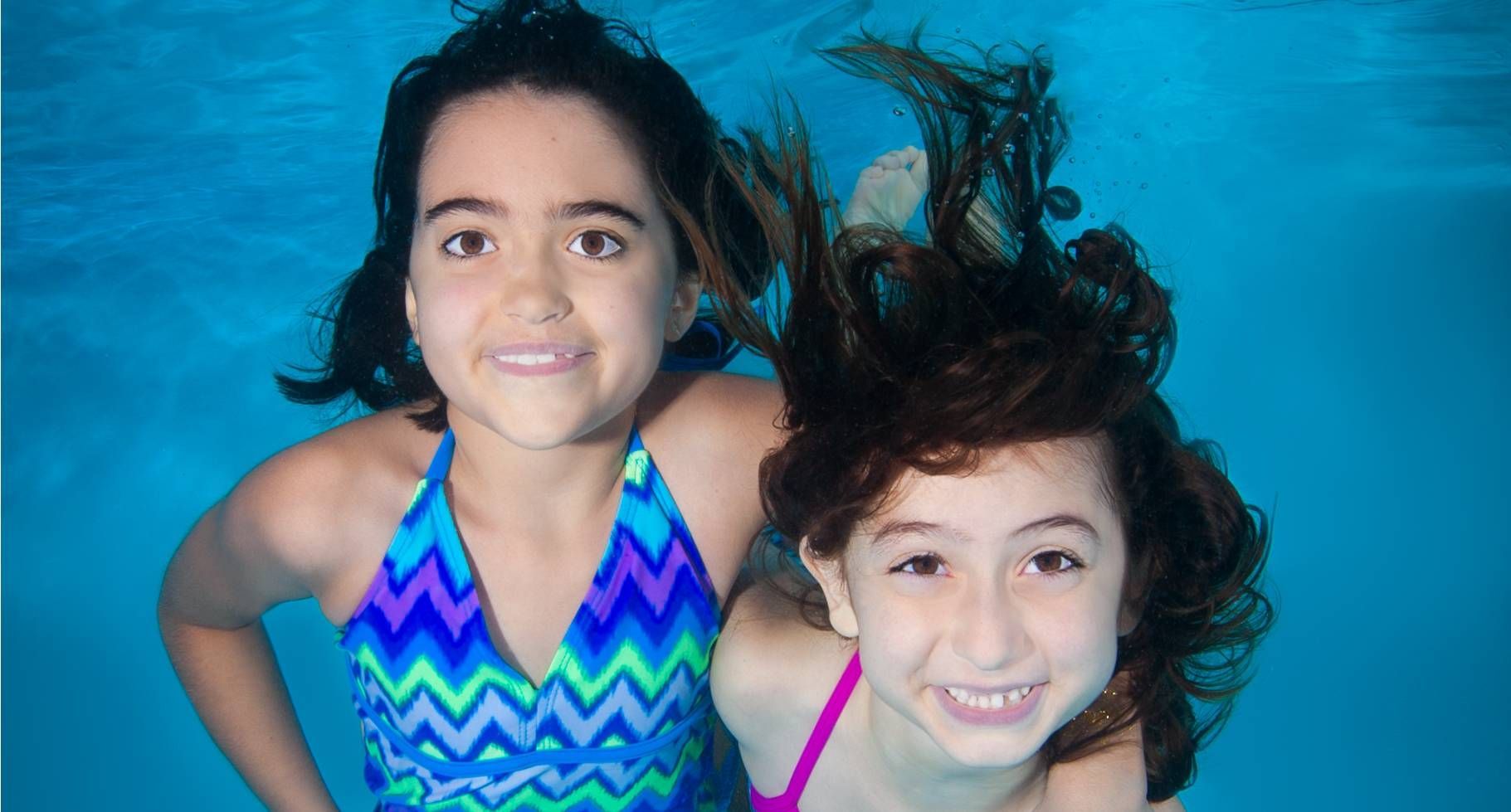 Photo of two girls swimming