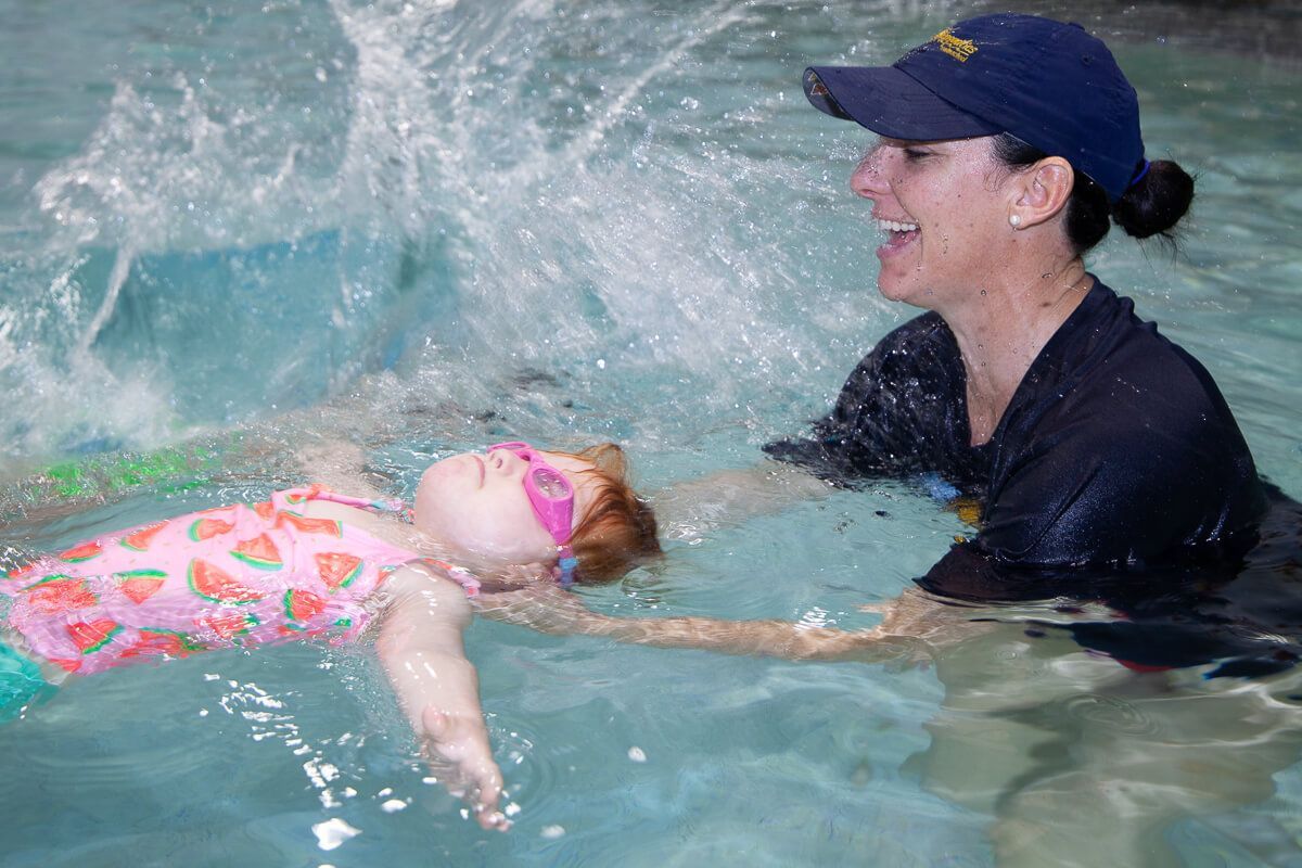 Girl learning backstroke