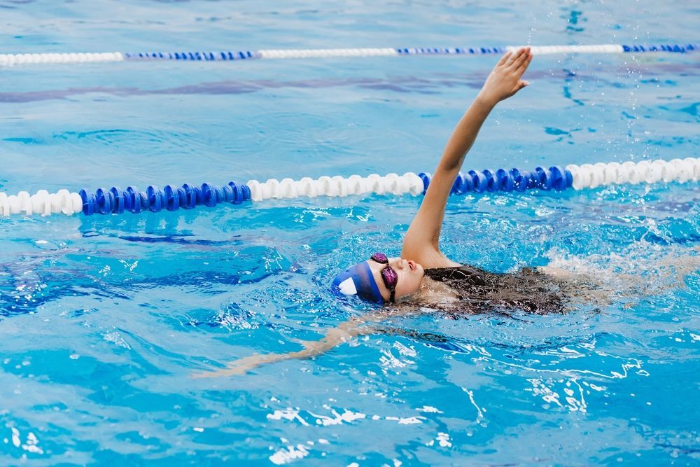 Photo of a Child Swimming in the Pool