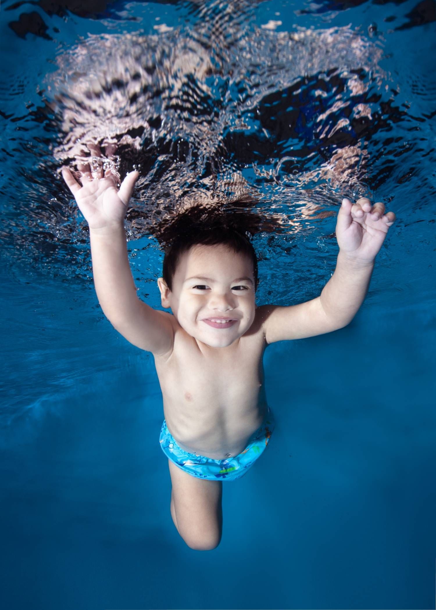 Photo of a Boy Swimming Underwater