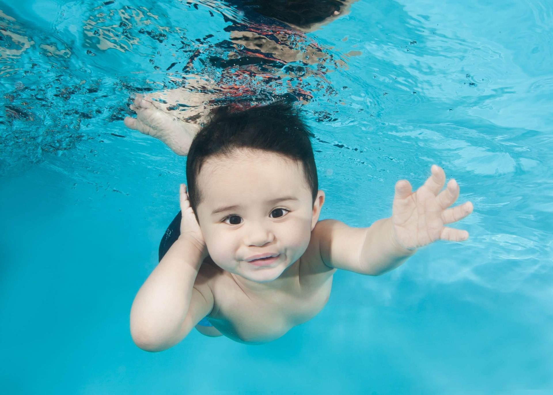 Underwater Young Boy Fun in the Swimming Pool