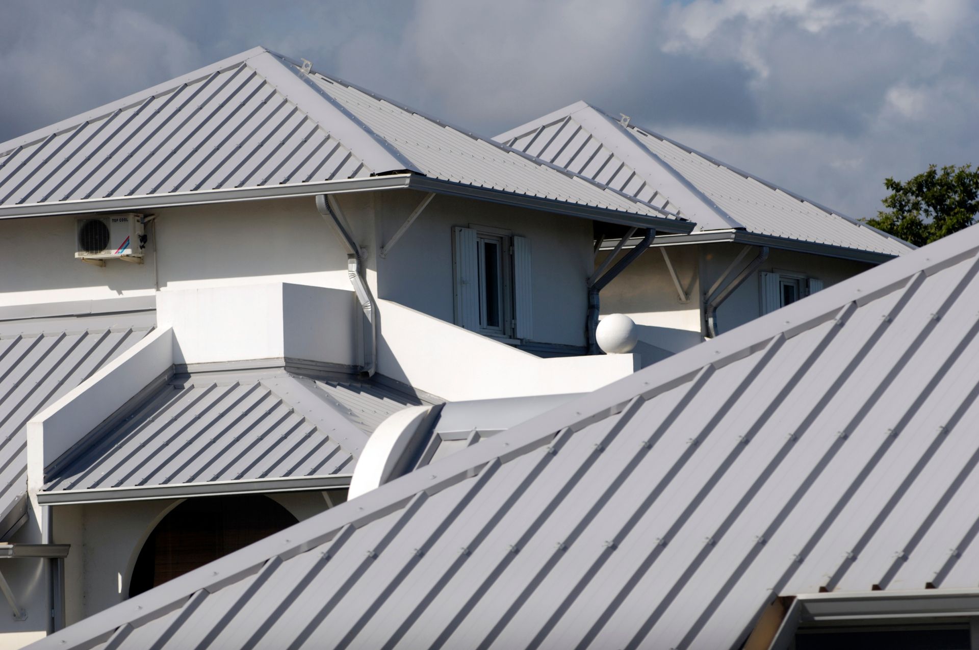 Durable metal roof installed on a home with products from a trusted roofing materials store.