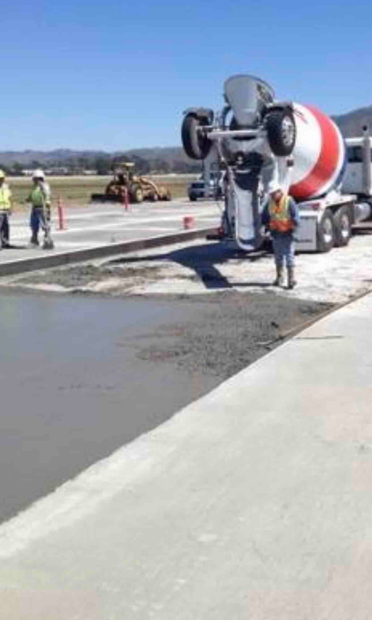 A concrete mixer on a construction site