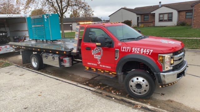 Red Towing Truck With Blue Container — Champaign, IL — Don’s 24 Hour Towing