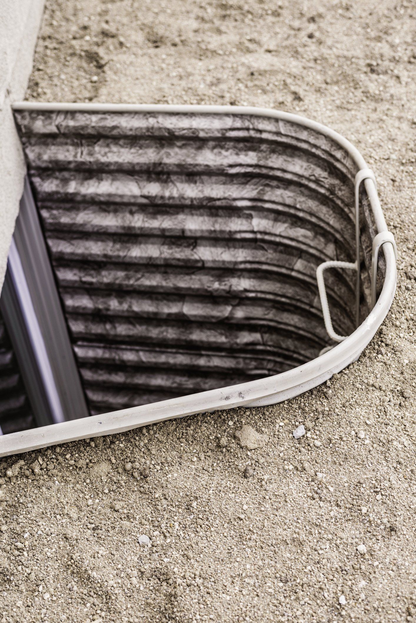 Uncovered Window Well With Escape Ladder — Annapolis, MD — Charles A Pastrana & Sons, Inc.