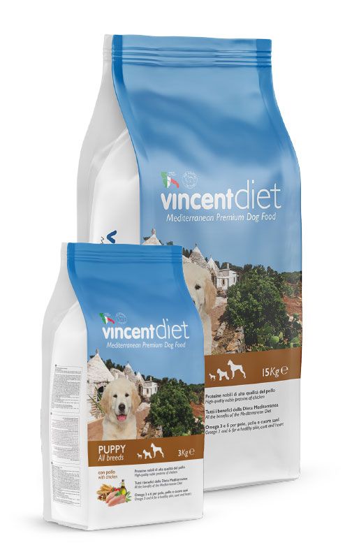 Due confezioni di cibo per cani Vincent Diet: per cuccioli e adulti. Confezione blu e bianca.