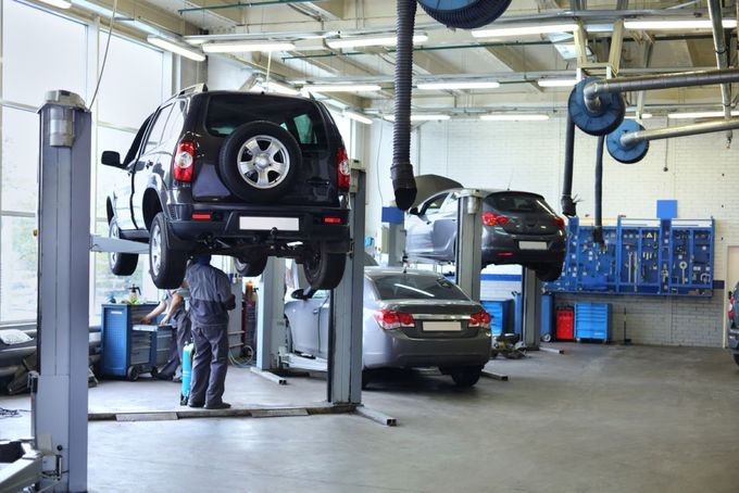 A Group of Cars on Lifts in An Auto Repair Shop — Coffs Coast Mobile Mechanical in Toormina, NSW