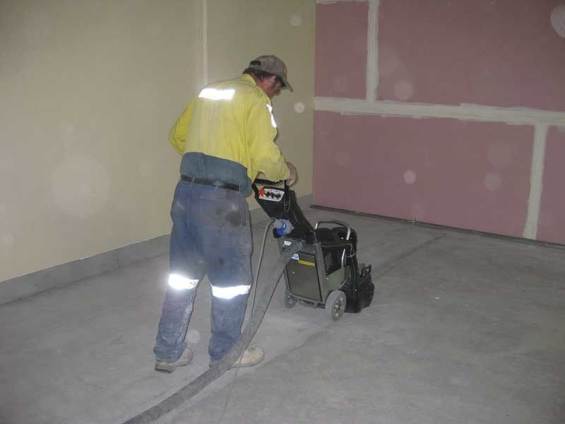 robert guy and sons using floor polisher