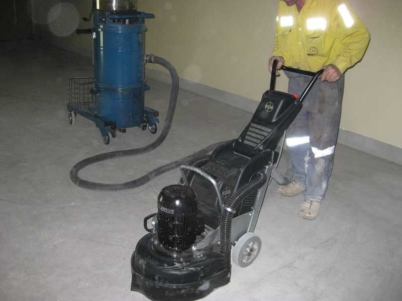 man with floor polishing machine