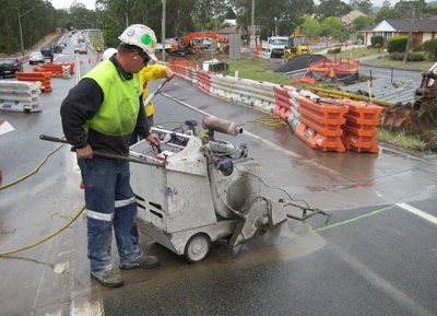 Man completing roadwork maintenance
