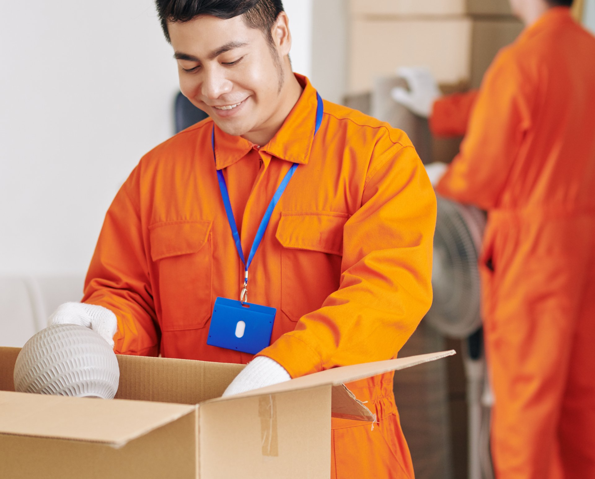 professional men packing moving boxes