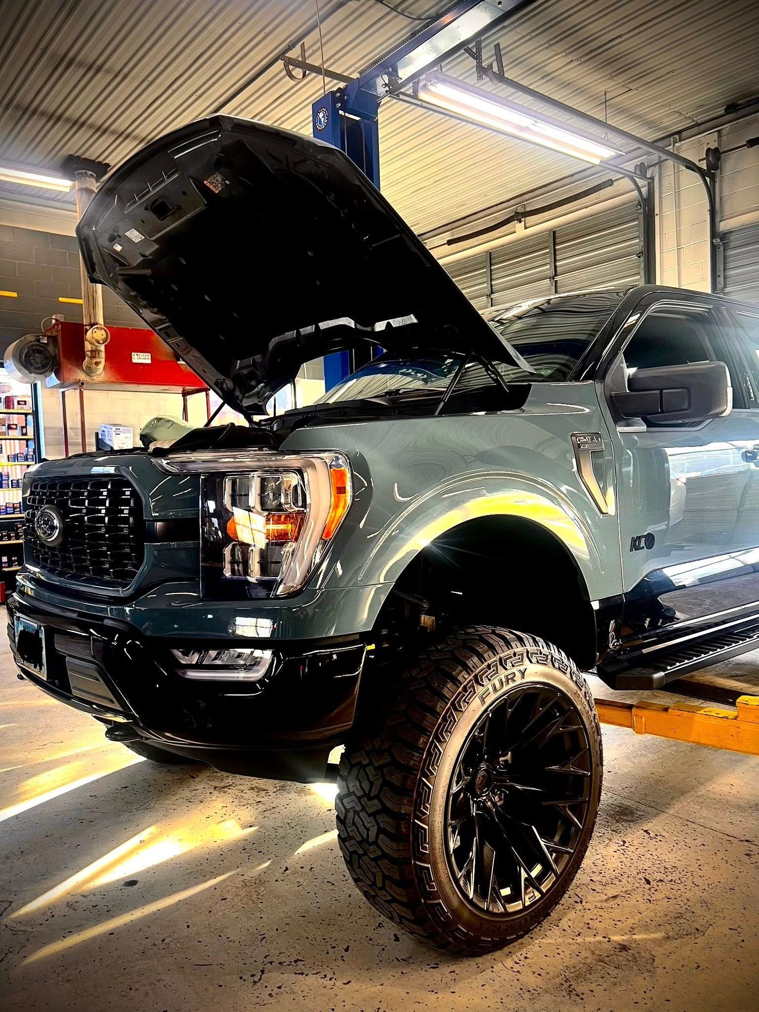 Ford with the hood up in for an Oil Change | JP Automotive, LLC