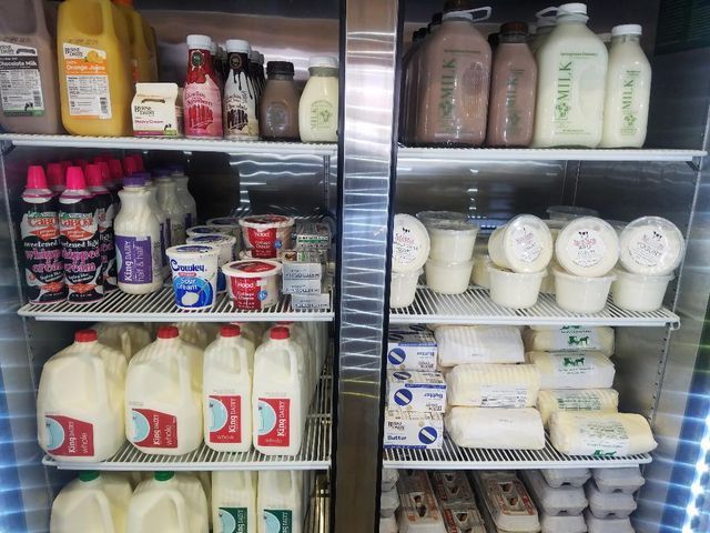A refrigerator filled with milk and other dairy products