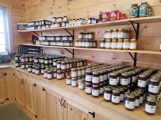 Shelves filled with jars of jam and jelly in a store