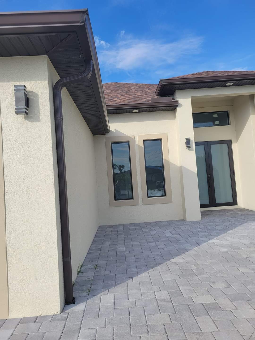 Beige house with brown gutter — St. Cloud, FL — MJ’s Home Solutions LLC