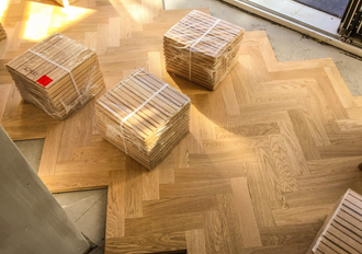 packs of wooden stacks on a floor
