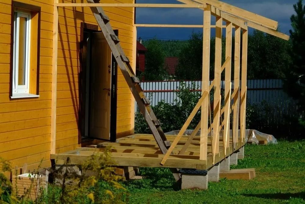 Wooden Porch Under Construction Beside a Yellow House — Greg Pollard Building in Banora Point, NSW