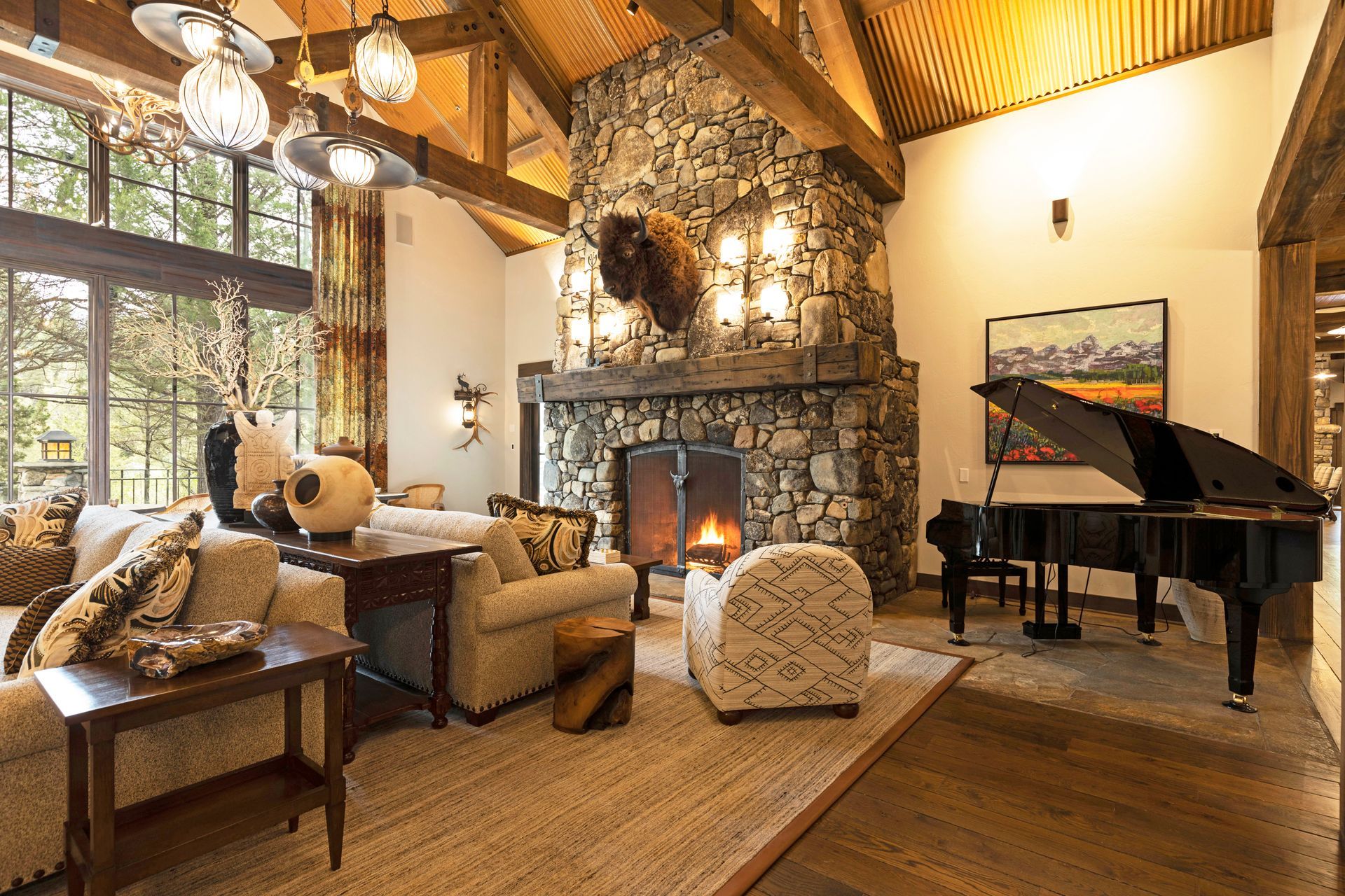 A living room with a piano and a fireplace