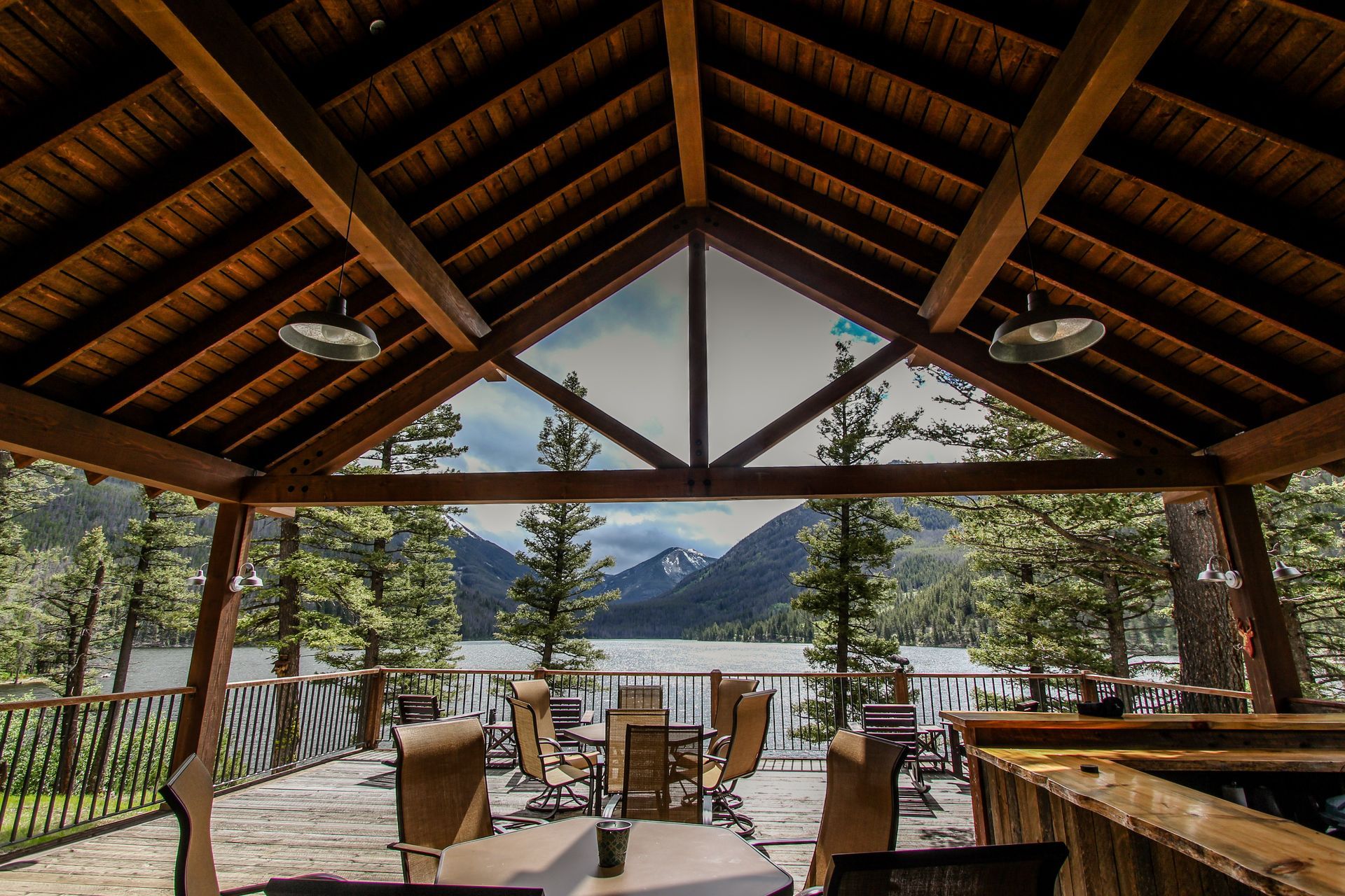 A gazebo with a view of a lake and mountains