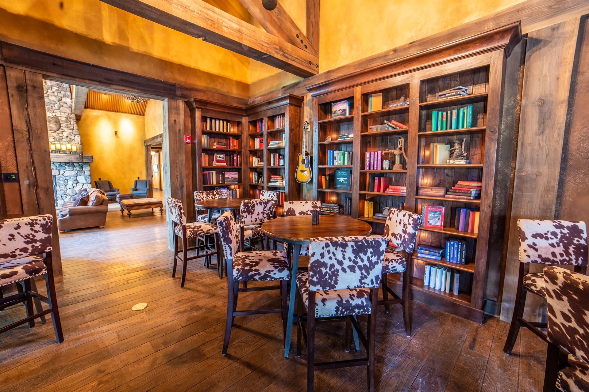 There is a table and chairs in the middle of the room.