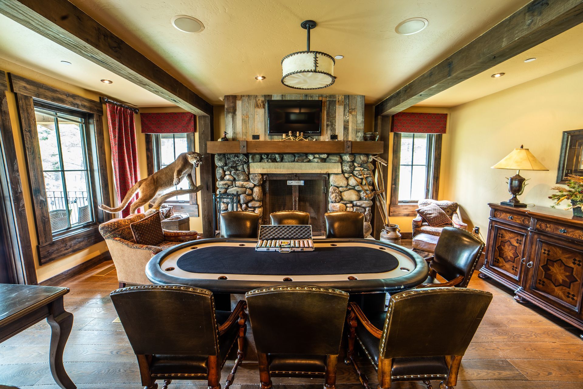 There is a poker table in the middle of the room.