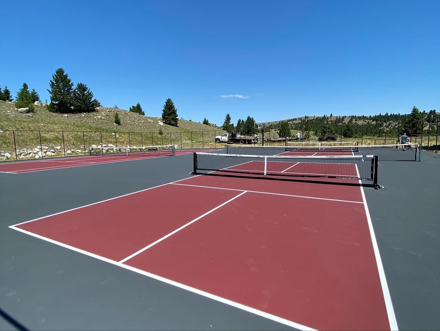 A tennis court with a net in the middle of it