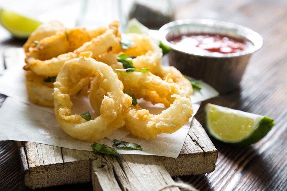 Fried Calamari Rings With Sauce And Lime Wedges — Mulgrave Seafoods In Bungalow, QLD