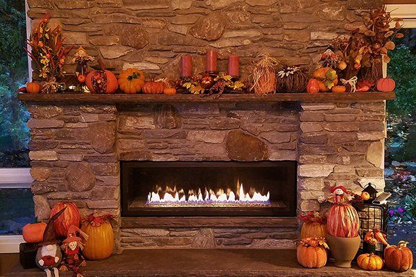 Brown Toned Custom Stone Fireplace — Thatcher, AZ — Woodside Construction, LLC