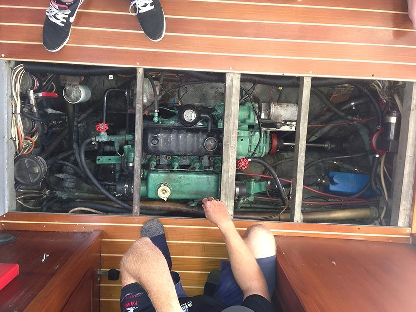 A Person is Working on the Engine of a Boat — Mackay Marine Services in Bowen, QLD
