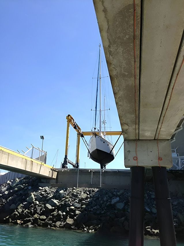 A Boat is Being Lifted — Mackay Marine Services in Mackay, QLD