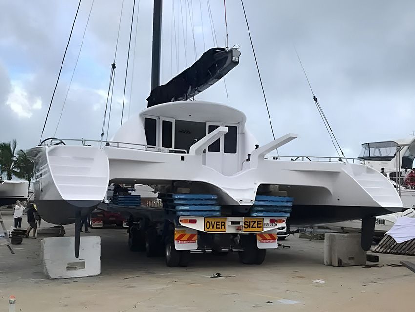 A Boat is Being Lifted Onto a Truck — Mackay Marine Services in Moranbah, QLD
