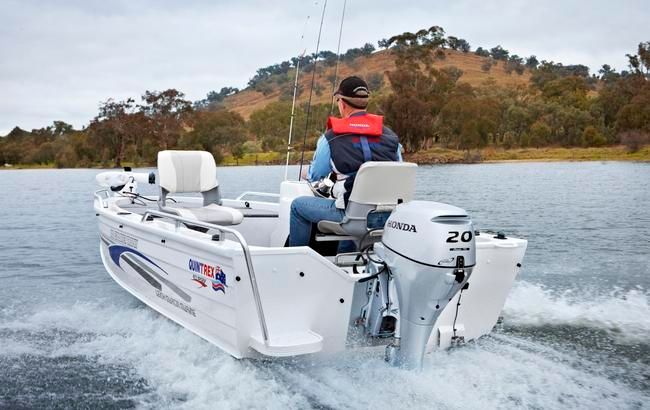 Man in a Small White Boat With a Motor on Water, Wearing a Life Vest, Fishing — TJM Rockhampton in Rockhampton City, QLD