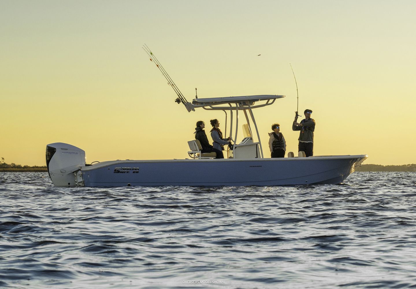 Fishing Boat on Water With Four People, Under a Sunset Sky — TJM Rockhampton in Rockhampton City, QLD